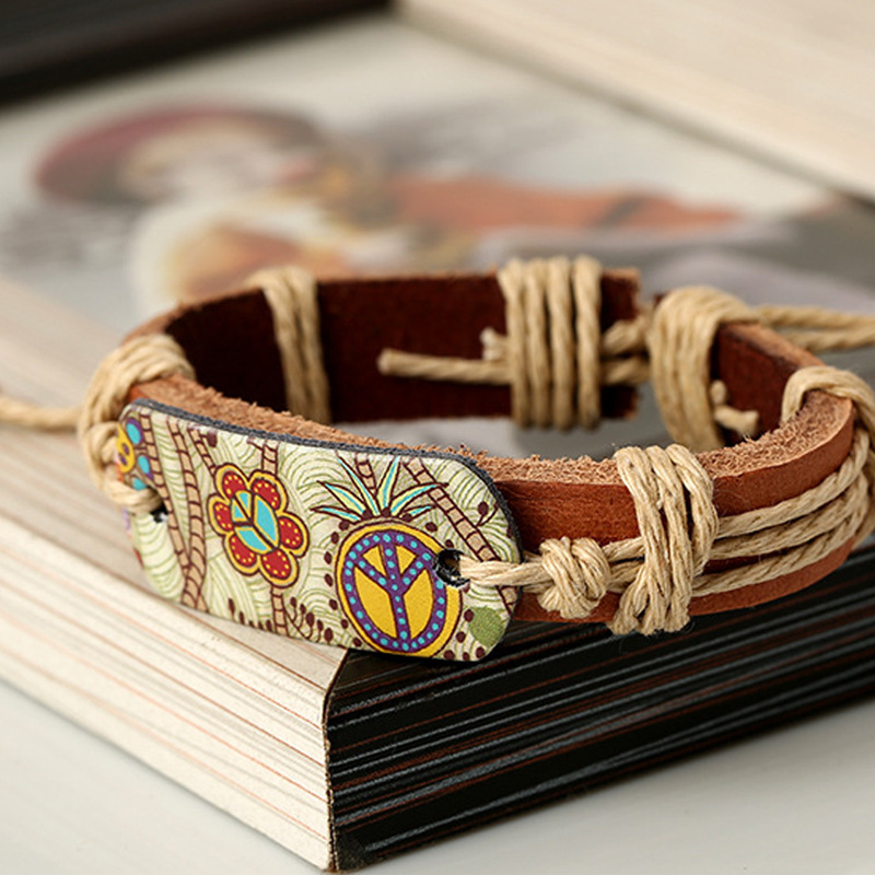 European and American fashion jewelry hemp rope woven cowhide bracelet retro style hot stamping peace logo leather bracelet a generation of hair