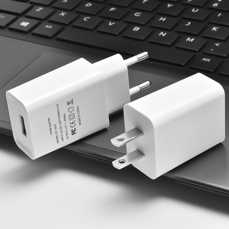 Hot 5V2A charging head mobile phone Bluetooth audio small appliance USB charger European and American gauge power adapter
