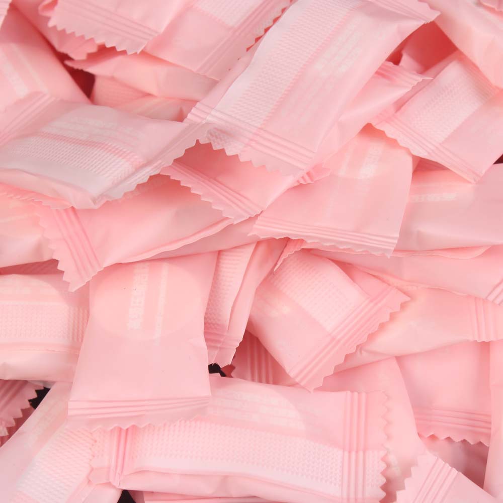 Pink packing compressed towel