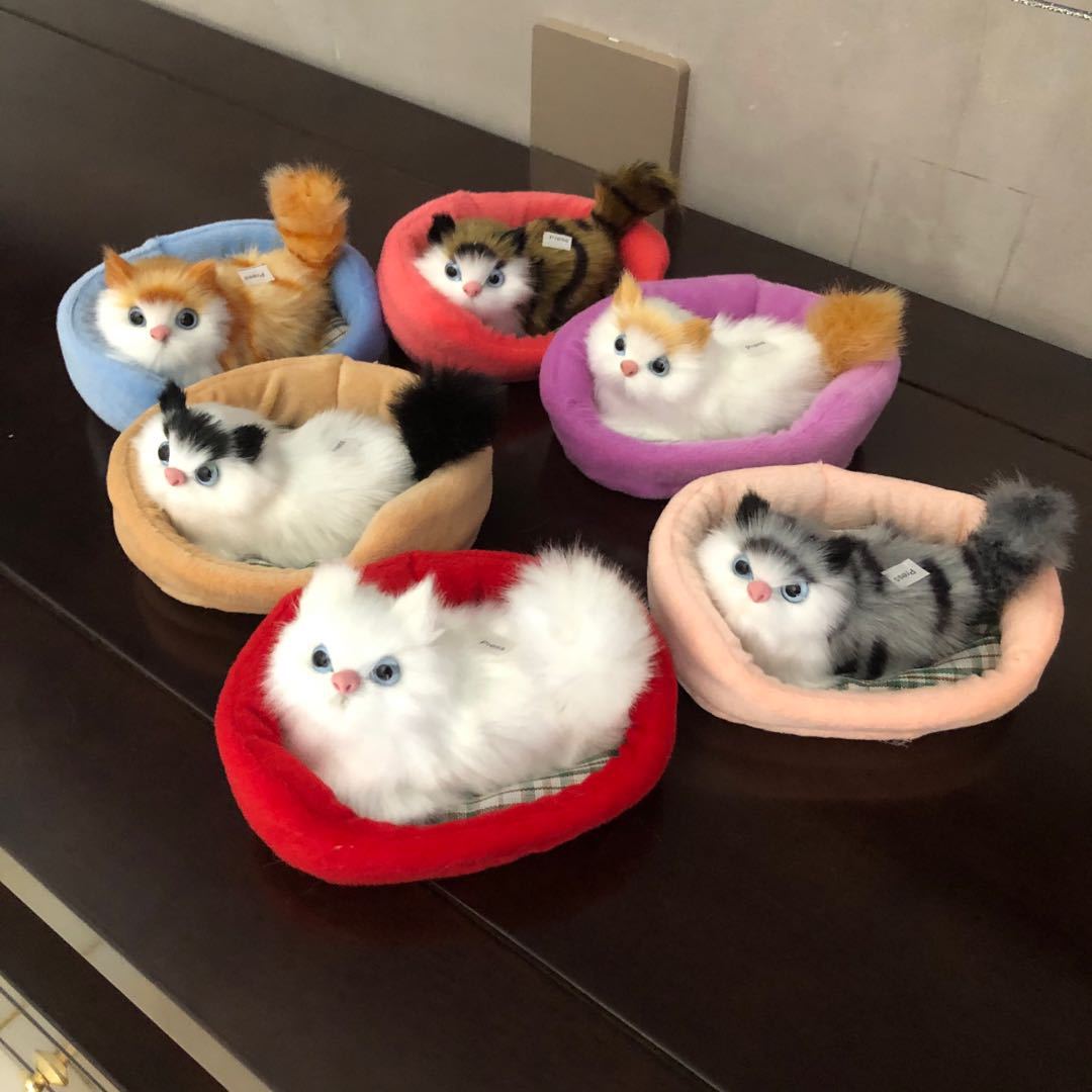 A simulated cat will call an animal ornament when pressed. Children's toys will call a cartoon toy plush toy.
