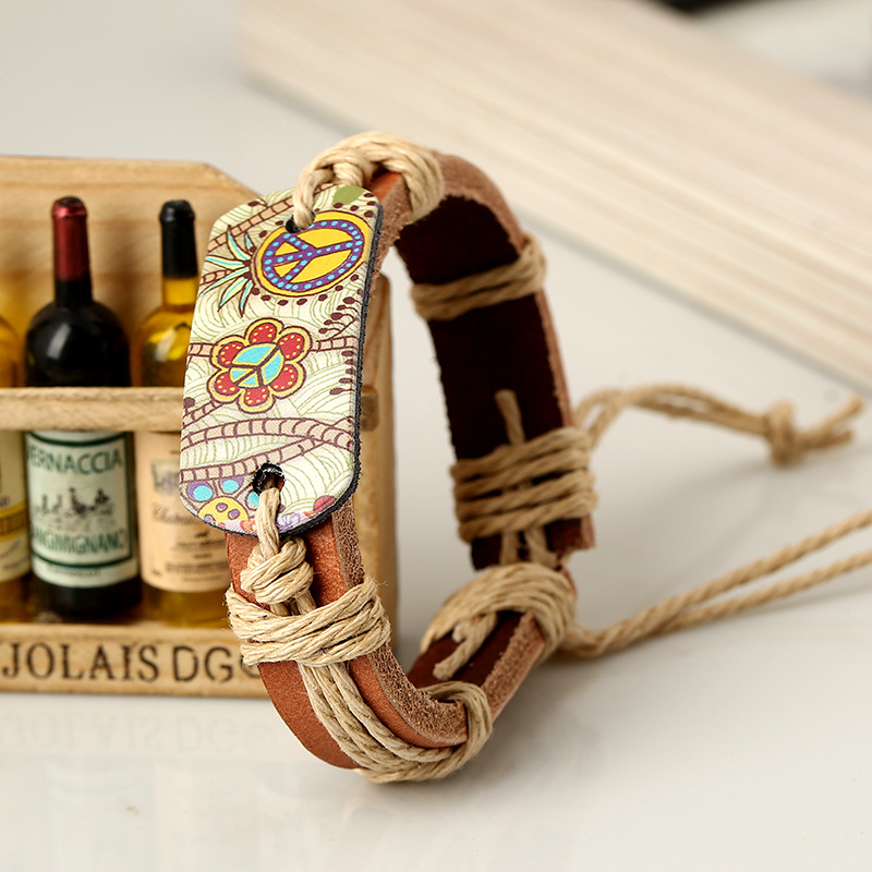 European and American fashion jewelry hemp rope woven cowhide bracelet retro style hot stamping peace logo leather bracelet a generation of hair