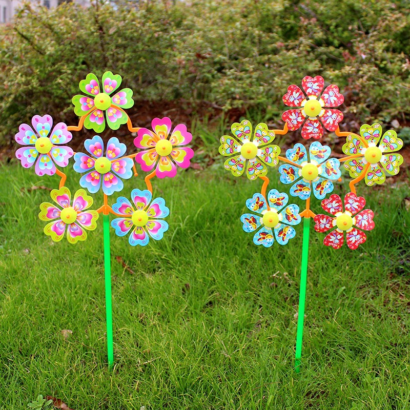 Hot sale gift rotating small size six-wheel children's toy cartoon outdoor decoration plastic colorful windmill stall wholesale