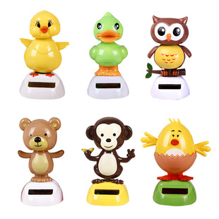 Car solar ornaments cartoon car decoration jewelry creative shake head cute doll gift factory direct sales