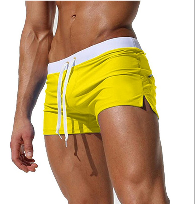European and American men's solid color sexy fashion back pocket design beach breathable quick-drying pants flat angle beach pants swimming pants