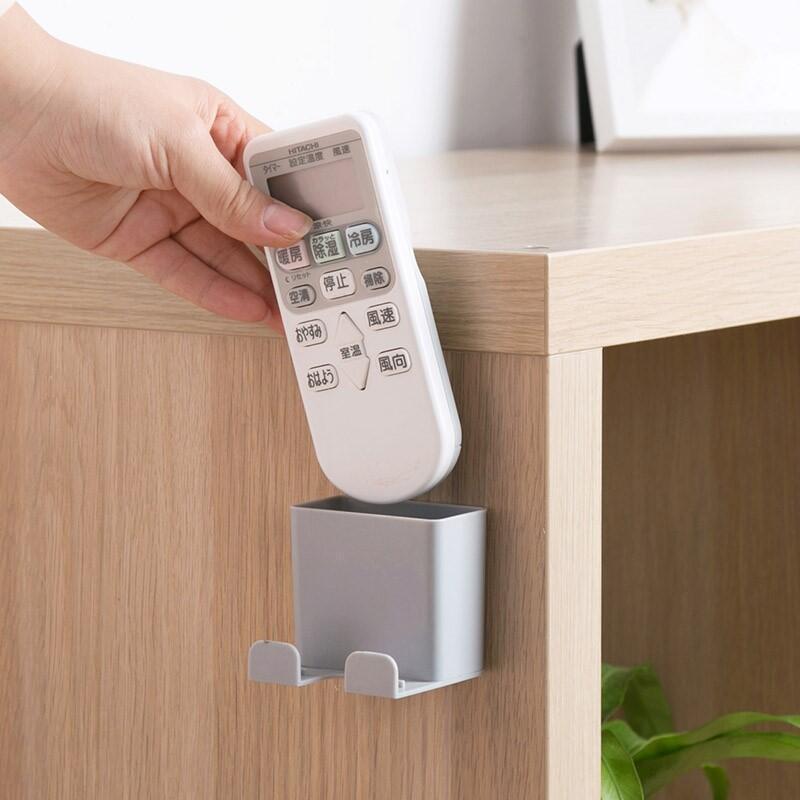 Creative and convenient mobile phone charging bracket multi-use wall-mounted remote control storage box wish Amazon foreign trade explosions