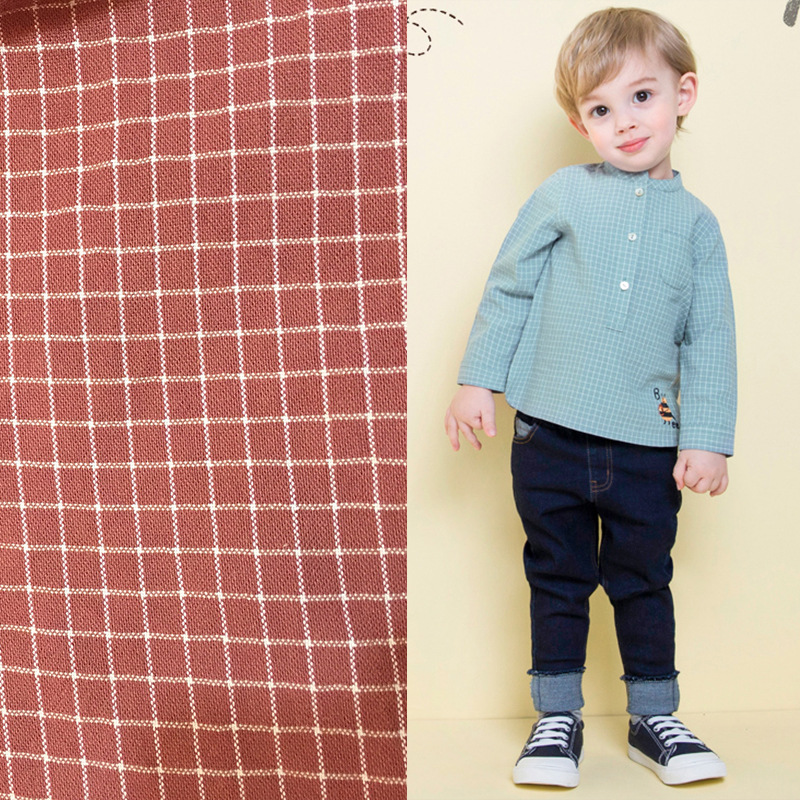 Factory wholesale cotton yarn woven plaid fabric 138cm width family wind jacquard sand wash plaid fabric
