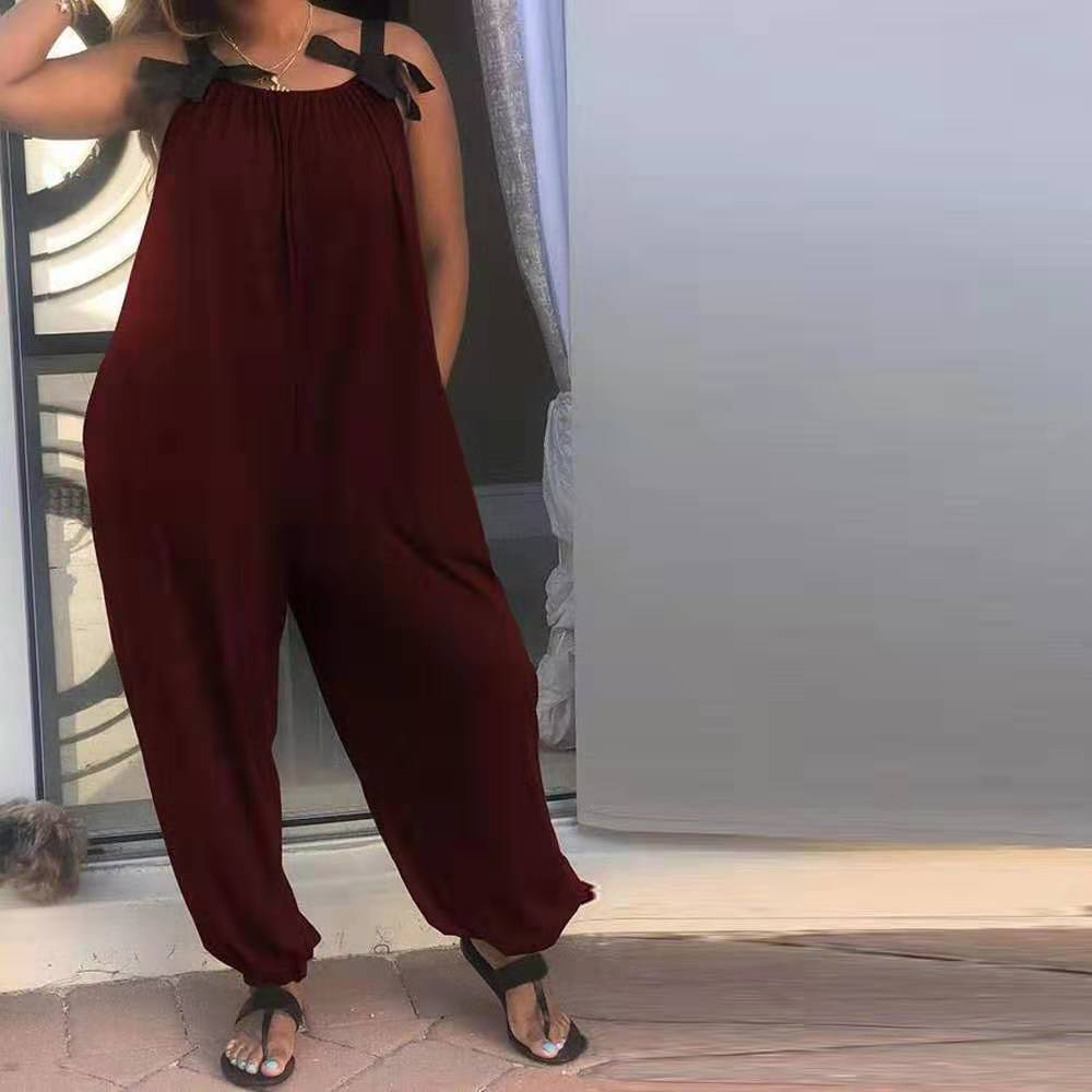 Amazon popular European and American women's solid color loose jumpsuit casual fashion bow shoulder strap sling jumpsuit