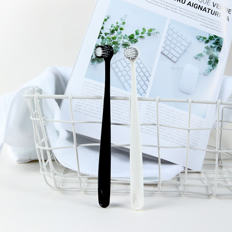 Couple toothbrush 2 pcs imported spiral hair toothbrush black and white round head adult soft hair toothbrush manufacturer