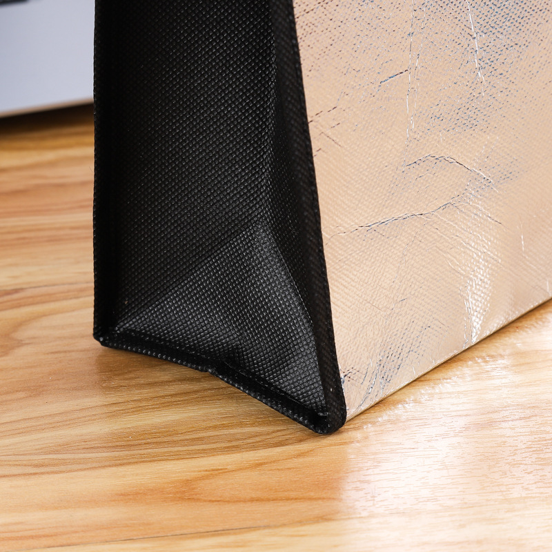 Factory custom wholesale laser folding non-woven bag silver gold film bag gift shopping bag
