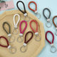 Spot creative woven leather rope keychain pu leather rope car pendant key chain to push small gift manufacturers wholesale