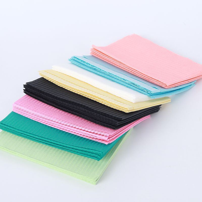 Factory production dental pad consumables wholesale various color disposable oral bib dental pad towel paper film cushion towel
