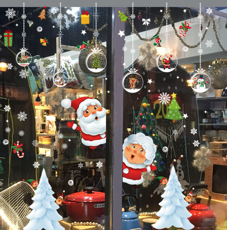 国境を越えたクリスマスシールの壁に静電を貼ってショーウインドーのガラスを貼ってサンタクロースのヘラジカのプレゼントのショーウインドーの装飾品を描いた|undefined