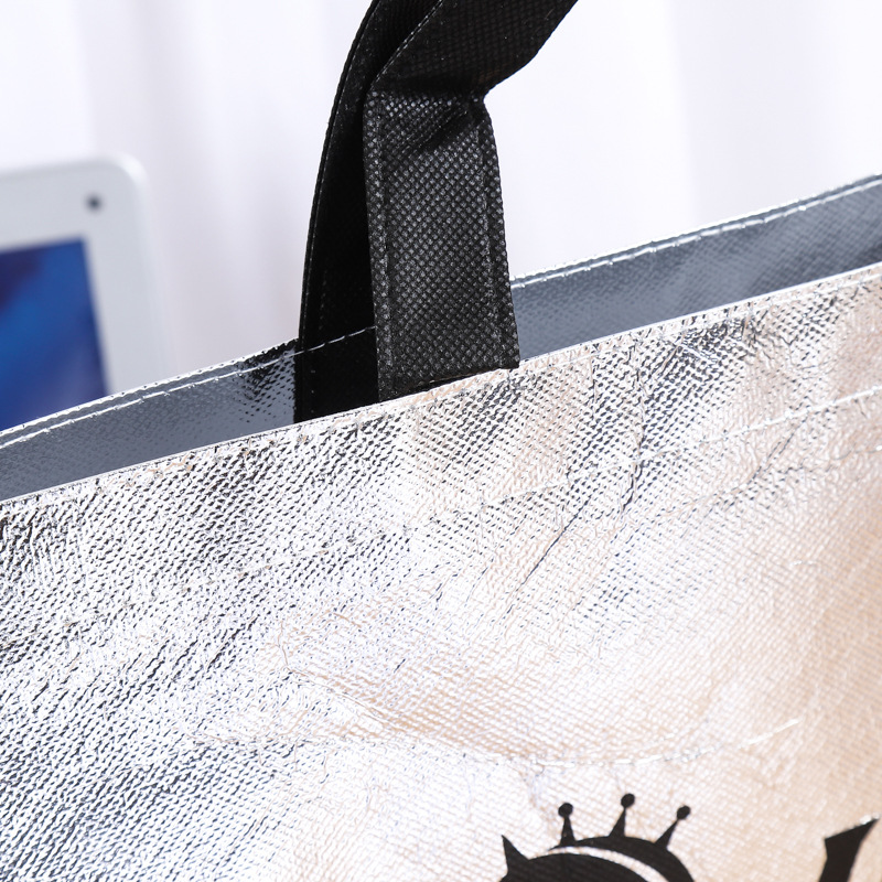 Factory custom wholesale laser folding non-woven bag silver gold film bag gift shopping bag