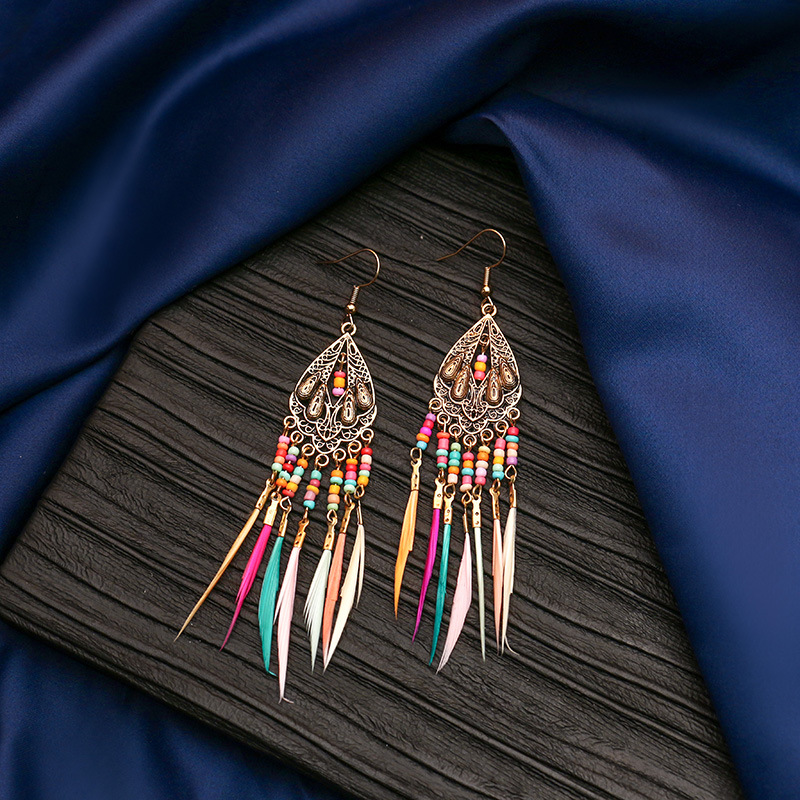 Hanqi jewelry European and American personality exaggerated hollow bohemian colorful rice beads feather tassel earrings