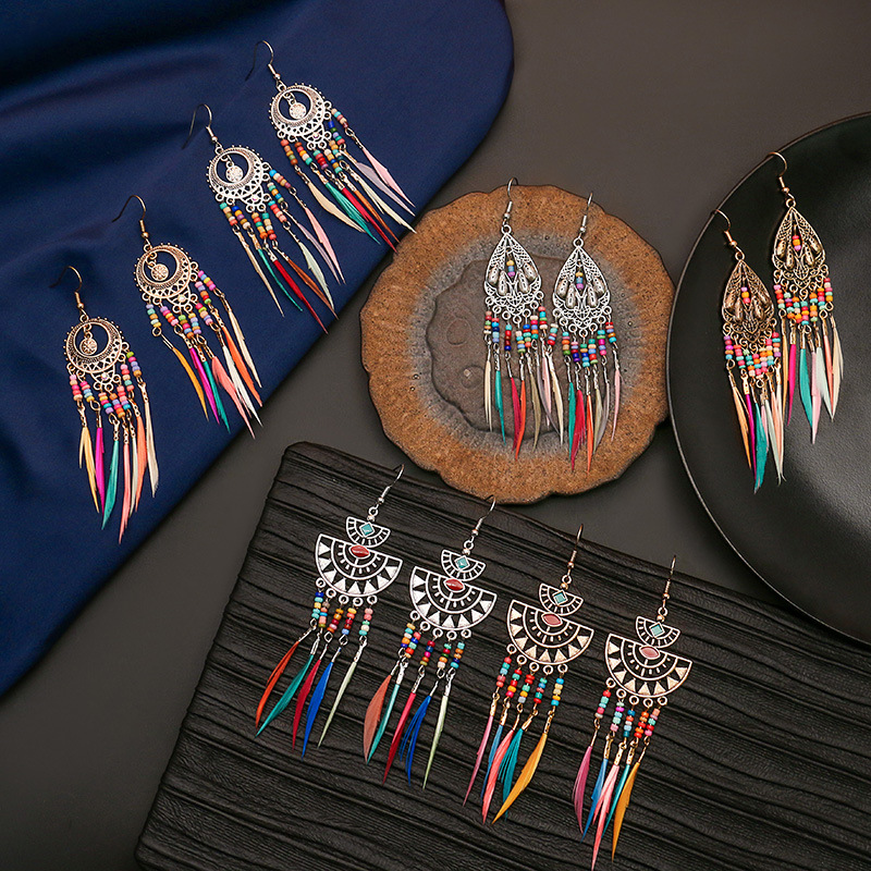 Hanqi jewelry European and American personality exaggerated hollow bohemian colorful rice beads feather tassel earrings