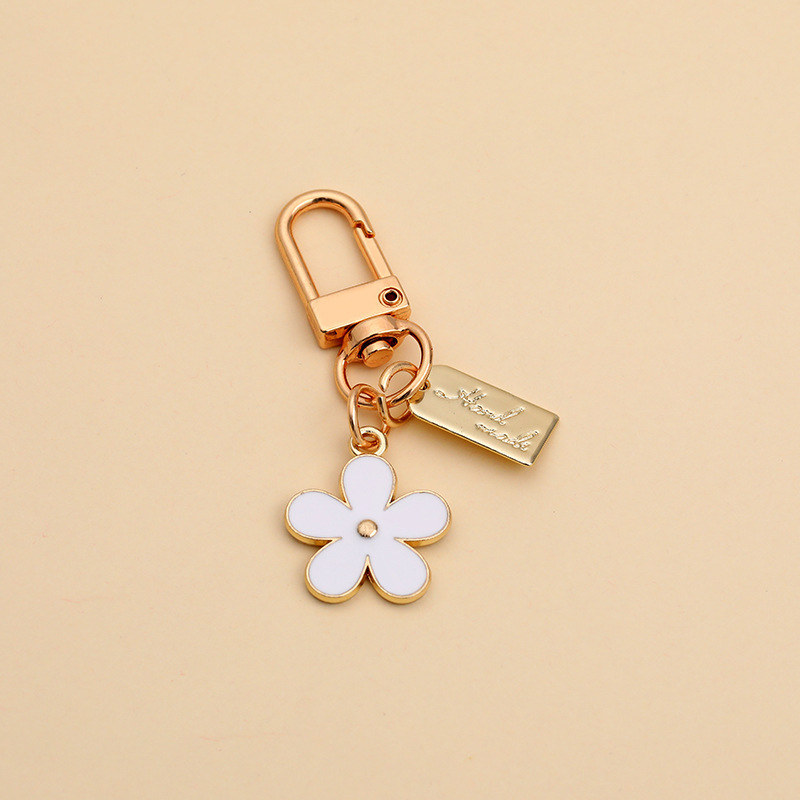 韓国ins金属の小さい菊のキーは小さい大衆の花のairpodsのbluetoothのイヤホンの保護カバーのアクセサリーを掛けます。|undefined