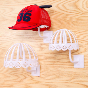 Children's hat rack display mother and baby shop plastic wall hat rack adult hollow hat support new sticky wall model head Wholesale