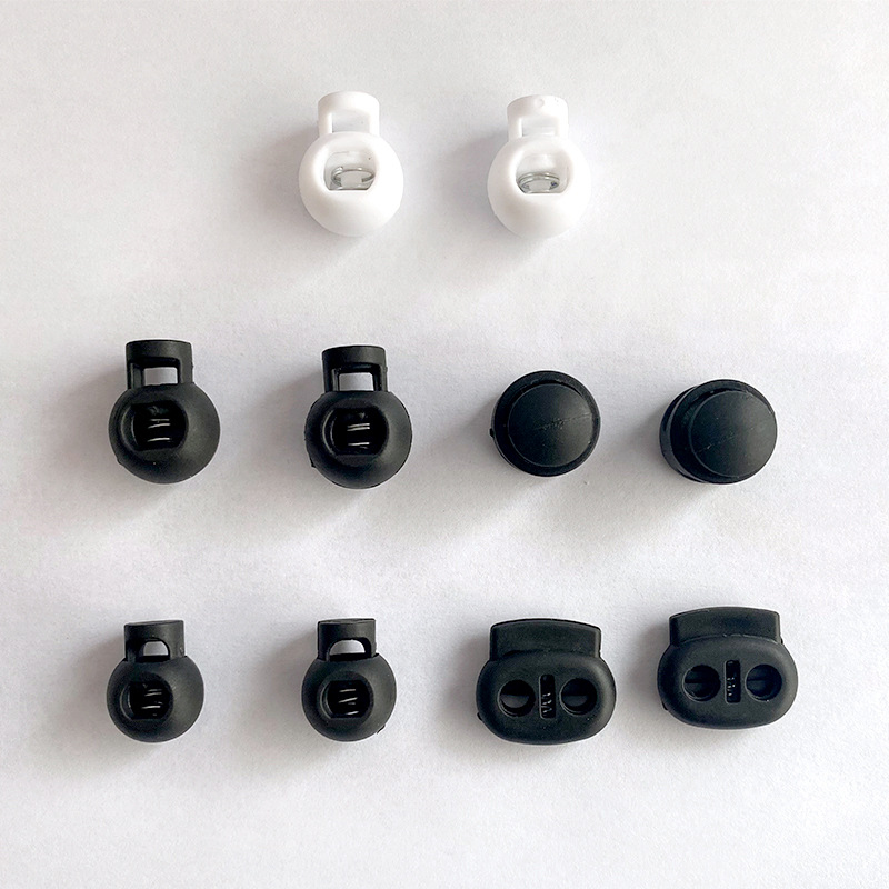 Single and double hole spring buckle windproof cap rope buckle flat single eye nylon pig nose buckle round bead luggage accessories plastic drawstring buckle