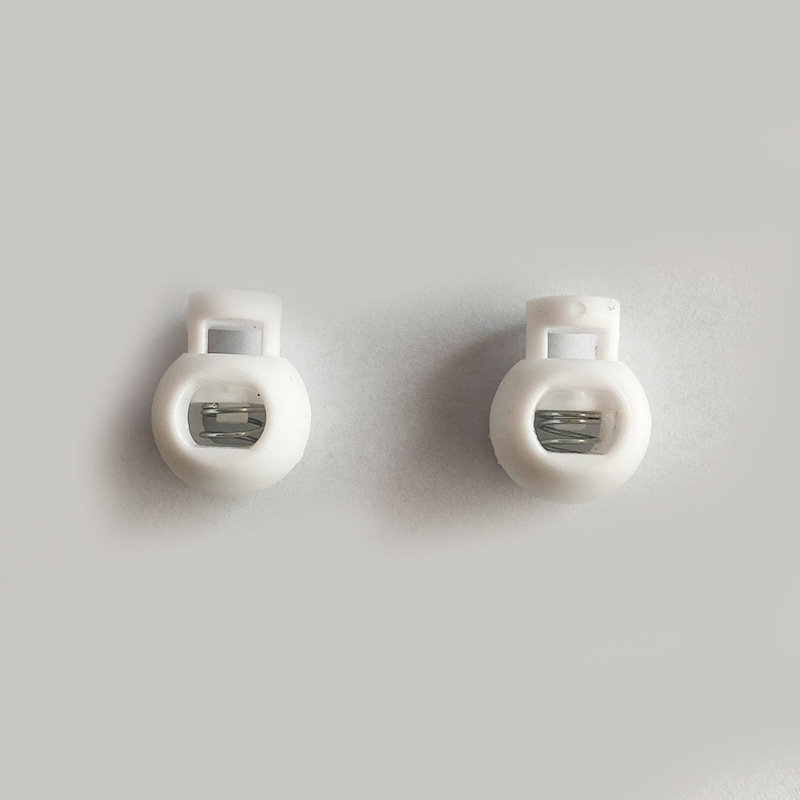 Single and double hole spring buckle windproof cap rope buckle flat single eye nylon pig nose buckle round bead luggage accessories plastic drawstring buckle