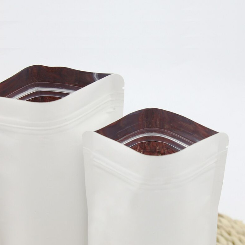 Inside aluminized white kraft paper bag snack food self-supporting self-sealing bag moisture-proof sealed dried fruit tea bag wholesale