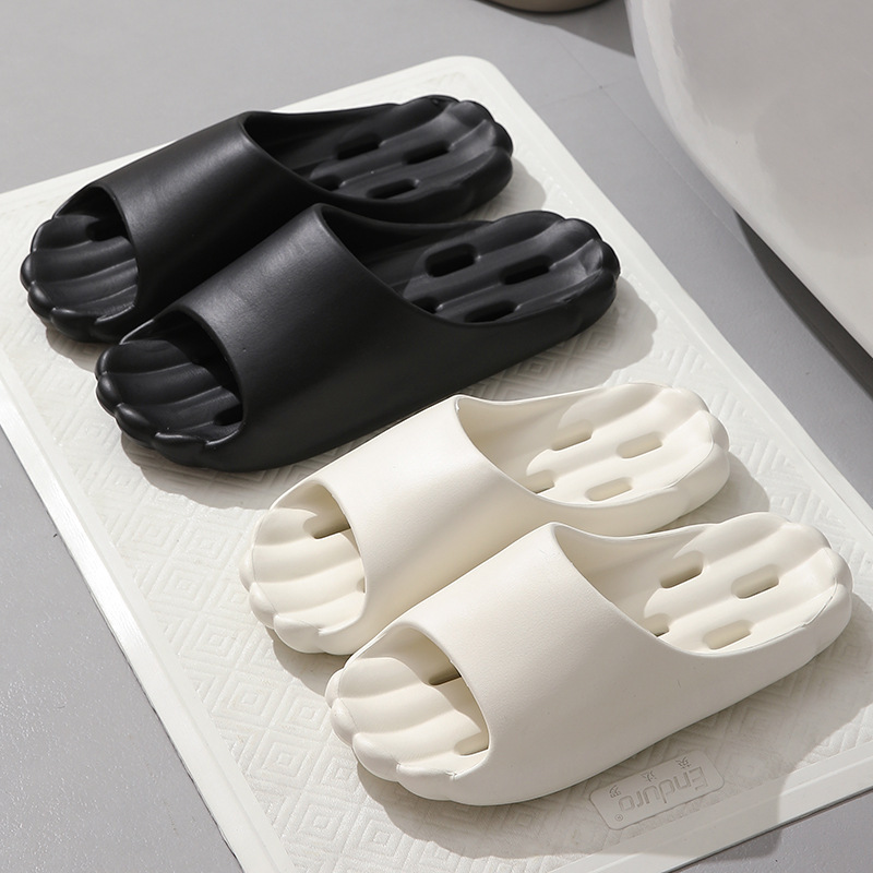 Bathroom quick-drying leaking slippers women's non-slip deodorant EVA material summer indoor bath hollow men's slippers wholesale