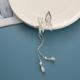 A silver butterfly tassel