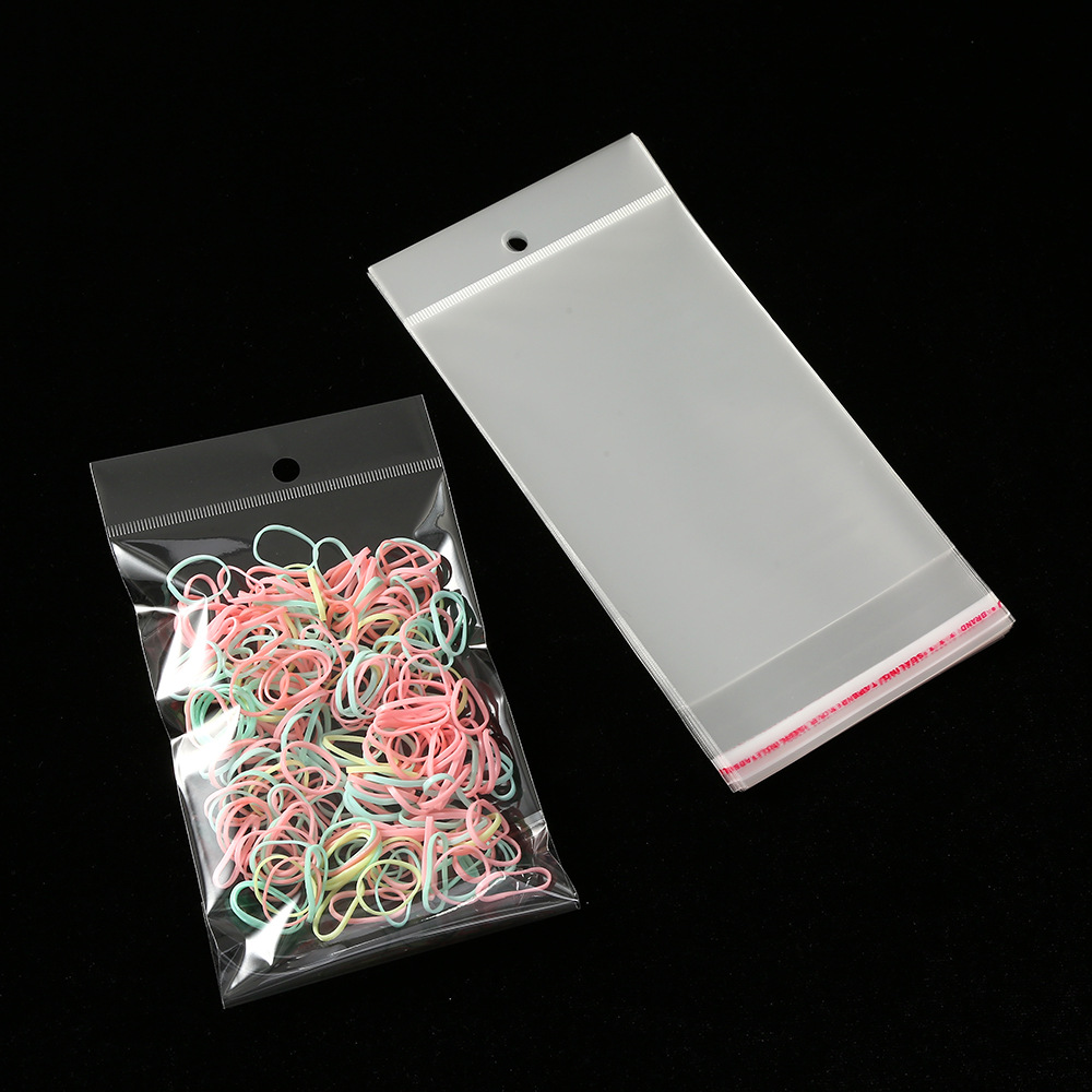 Spot OPP self-adhesive bag card head hanging hole transparent bag Pearl film card head bag aircraft hole transparent bag can be printed
