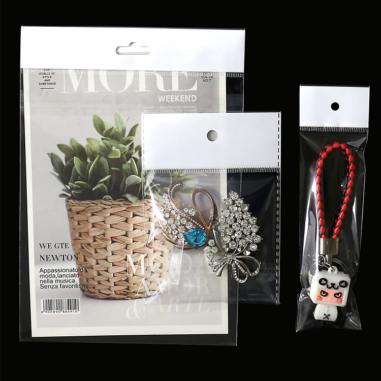 Wholesale White Pearl film hanging hole packaging plastic transparent clothes jewelry mobile phone self-adhesive bag opp card head bag