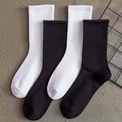 Socks women in autumn and winter lovers black and white solid color high socks ins tide socks men factory direct a generation of hair