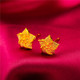 A pair of No.11 earrings including earplugs