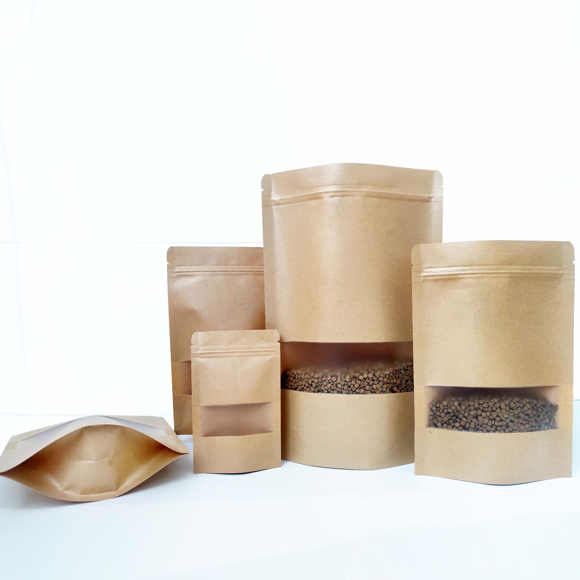 Wholesale window Kraft paper bag nut snack self-standing self-sealing bag tea sealed bag Kraft paper food packaging bag