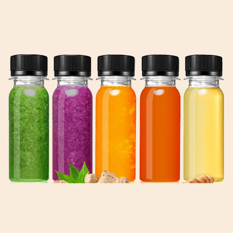 Wholesale 2oz cylindrical plastic juice bottle 60ml transparent beverage container with lid food grade pet material