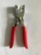 A pair of iron pliers
