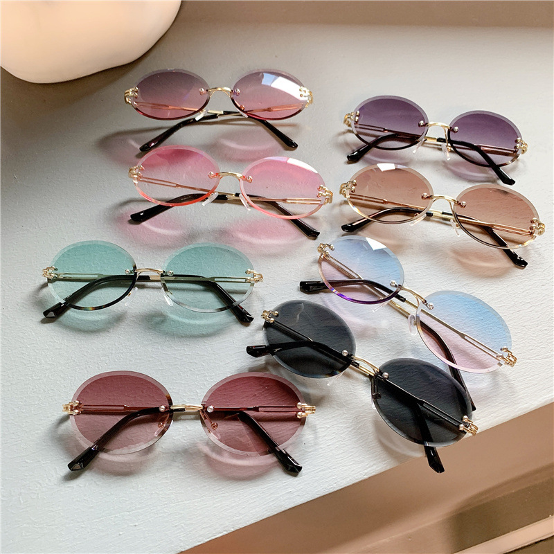 Nuevas gafas de sol transfronterizas para mujer, gafas de sol con degradado rojo ovalado en red, sin marco, gafas de moda al por mayor_voghion.com