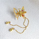 A golden tassel with colored beads