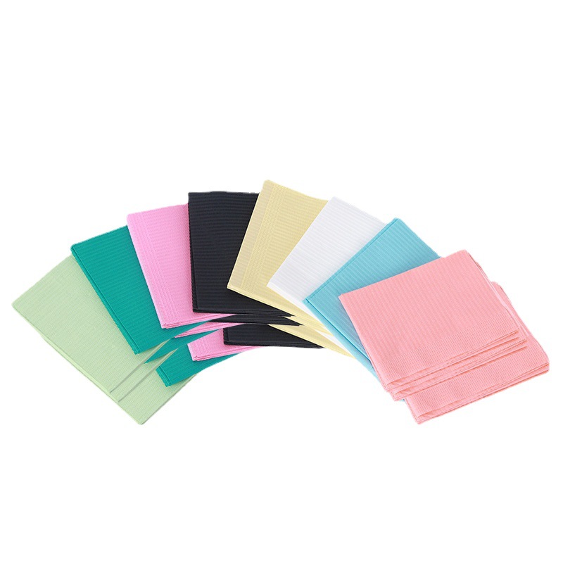 Factory production dental pad consumables wholesale various color disposable oral bib dental pad towel paper film cushion towel