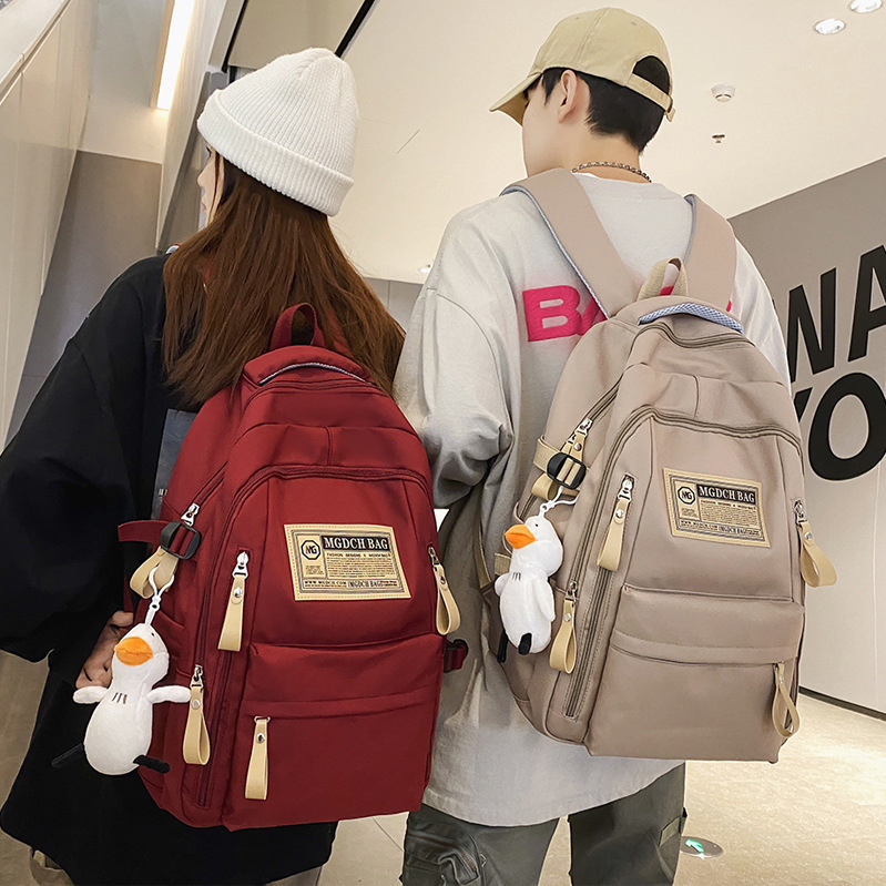 新しいカバンの女子大学生の中学生の少女のランドセルのシンプルな大容量の男子のリュックサックの卸売り|undefined