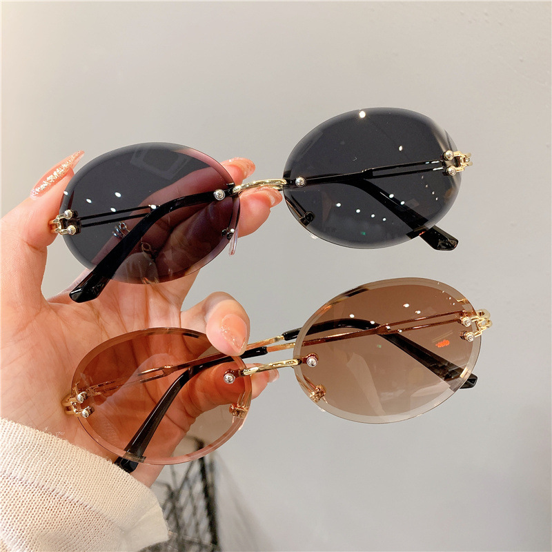 Nuevas gafas de sol transfronterizas para mujer, gafas de sol con degradado rojo ovalado en red, sin marco, gafas de moda al por mayor_voghion.com