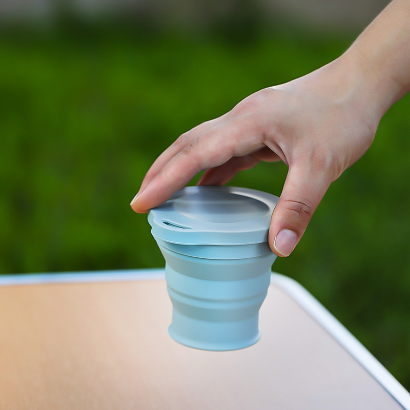 Creative foldable silicone cup with hanging holes, stylish travel silicone cup for outdoor trips and travel grooming