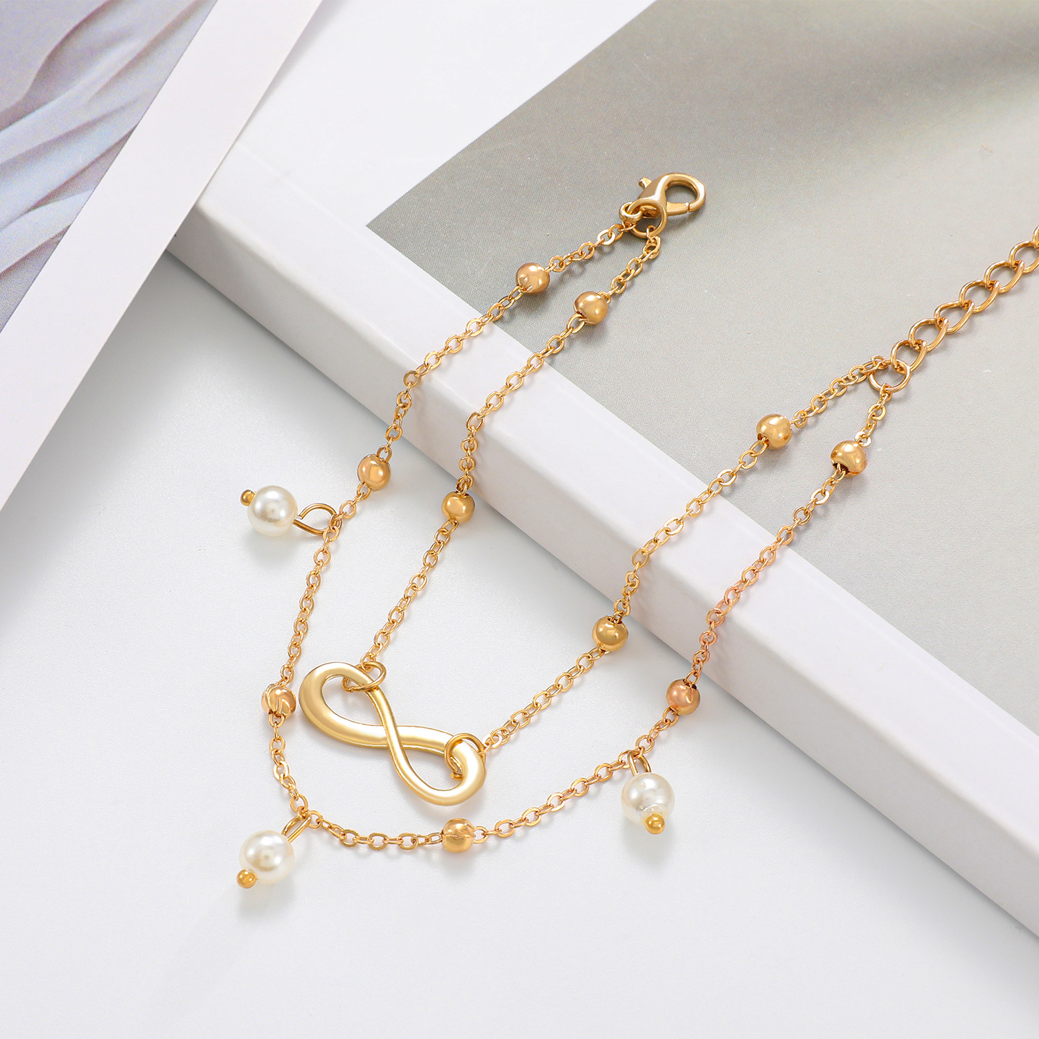 European and American fashion hot selling Pearl 8-word anklet jewelry women's handmade beaded double-chain foot jewelry beach foot jewelry wholesale