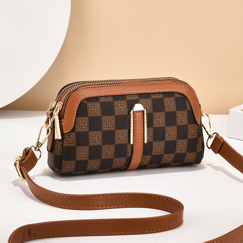 2024 Korean version of the new plaid printing fashion mini Joker messenger bag shoulder change small bag a generation of hair