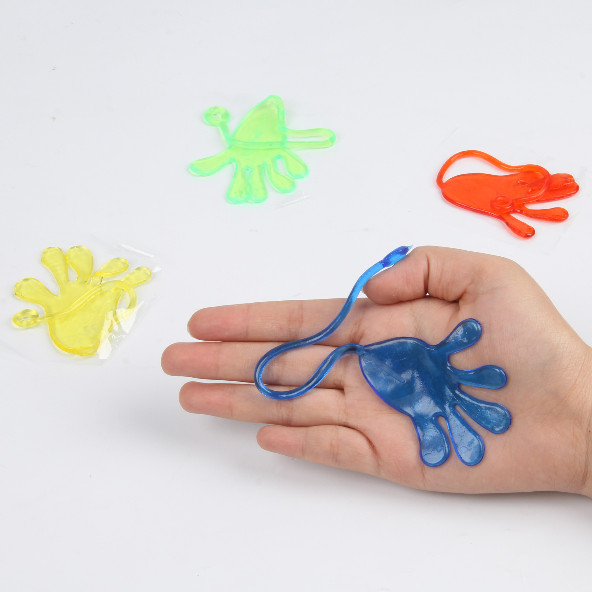 Retro elastic stretchy adhesive palm trick toy; prank little hand stretchable soft rubber elastic palm