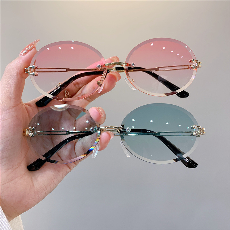 Nuevas gafas de sol transfronterizas para mujer, gafas de sol con degradado rojo ovalado en red, sin marco, gafas de moda al por mayor_voghion.com