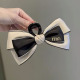 Black Face and White Bottom Bow Grab Clip