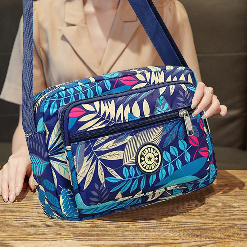 2024 nylon cloth middle-aged and elderly mother flower cloth bag shoulder slung large capacity mobile phone bag factory supply postage