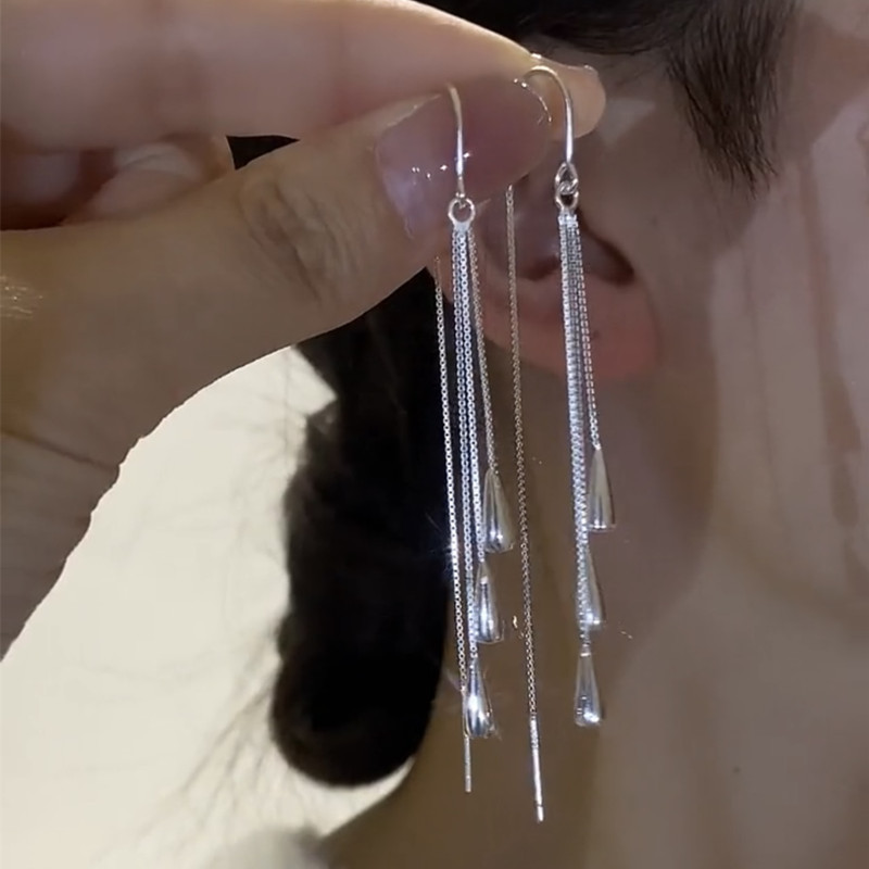 雰囲気の銀色の長いタイプの水滴のフリンジの耳の線の女性の新型の湿った豪華な高級感は顔のやせているイヤリングのシンプルな耳飾りを現します。|undefined