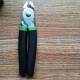 green and black flat-head pliers