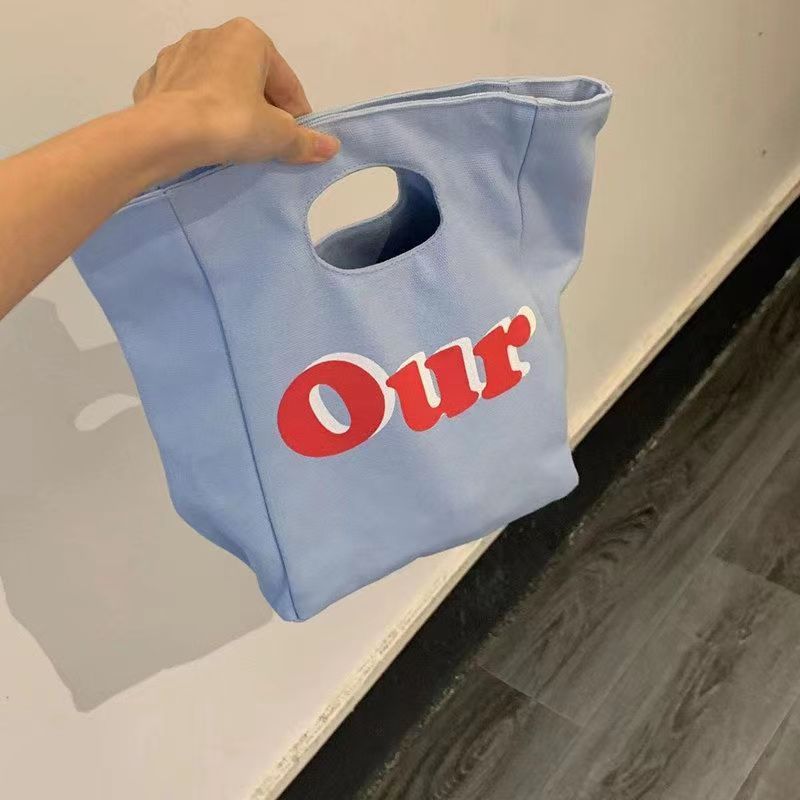 A generation of small design cute hand bag tote bag leisure commuter lunch box bag cosmetic bag storage bag women