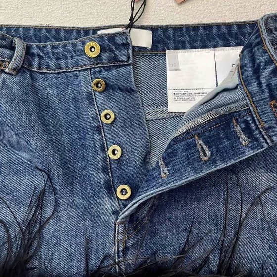 Niche design 24 early spring new personalized feather decoration Denim V-neck strap high waist skirt slimming suit