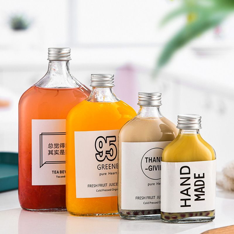 Cross-border glass beverage bottle milk tea bottle empty small wine bottle coffee cold extract bottle sealed fruit wine bottle oblique shoulder flat bottle wholesale